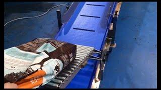 Adjustable Discharge Roller Conveyor to Modular Belt Conveyor System at C-Trak Ltd