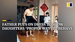 Chinese father puts on dress to show daughters ‘proper way’ to behave