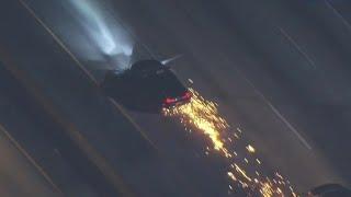 Sparks fly on police chase suspect's car in LA